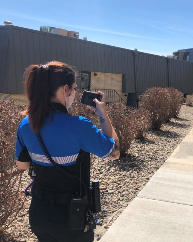 HSPPR ALE Officer takes a photo on her cellphone to collect evidence