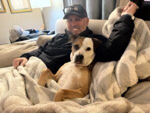 Millie cuddling with her dad, Zach.